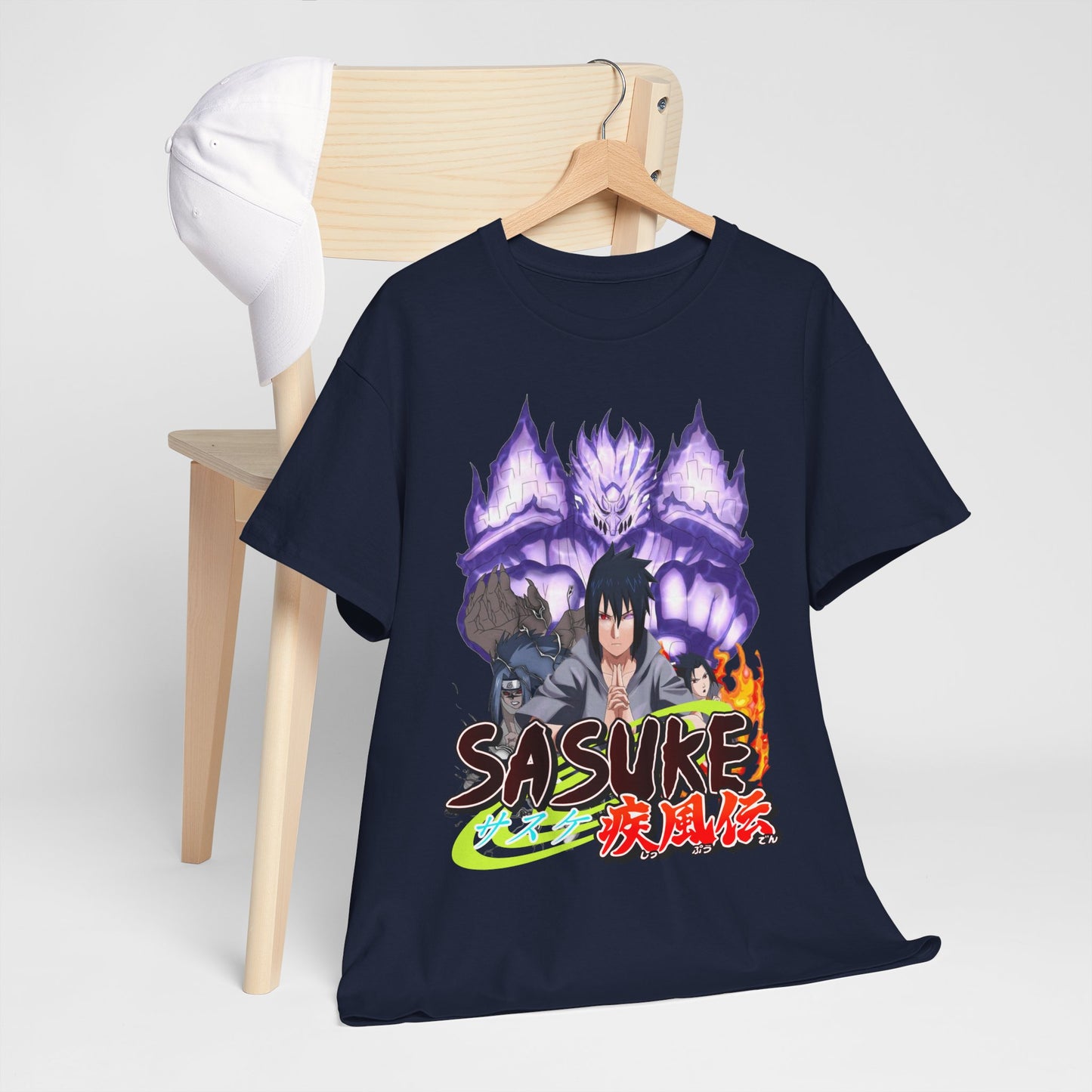 Stylish Sasuke Graphic Tee draped over a wooden chair, paired with a chic cap, radiating sophisticated anime fashion.