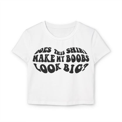 Elegant white women's t-shirt featuring the humorous slogan 'Does This Shirt Make My Boobs Look Big?' in a retro font, perfect for a playful casual style.