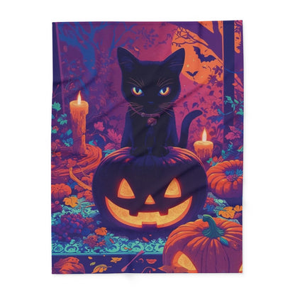 Decorative and Warm Halloween Spooky Arctic Fleece Blanket featuring a black cat sitting atop a carved pumpkin, surrounded by candles and autumn leaves.
