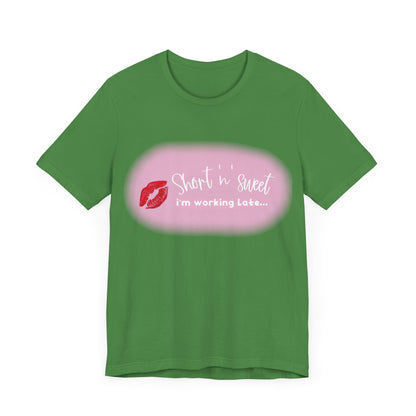 Front view of the elegant Sabrina Carpenter Inspired Unisex Short Sleeve Tee, featuring a vibrant lipstick print and playful text, perfect for stylish individuals.