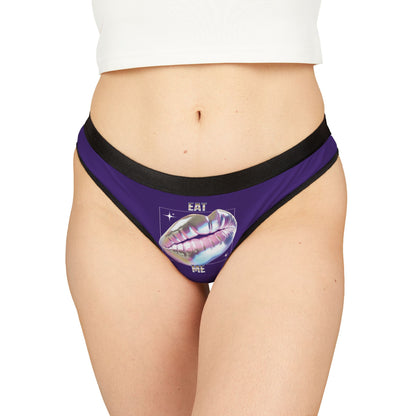 Luxury women's purple thong featuring holographic lips and 'EAT ME' text, designed for playful elegance