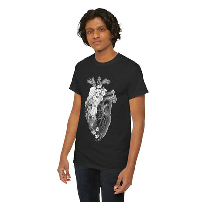 Contemporary black graphic T-shirt with a captivating floral heart illustration, designed for a refined casual look on a fashionable model.