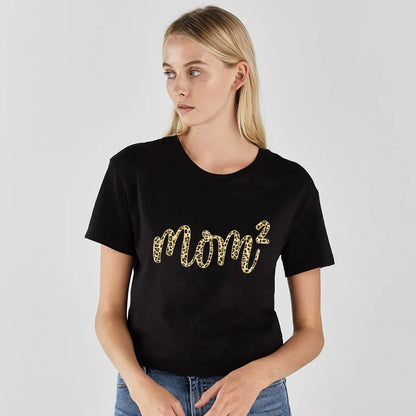 Model showcasing the Leopard Lips Print Women's T-Shirt from Dazzling Dreams Studio, epitomising elegance and fashion-forward style for summer gatherings.