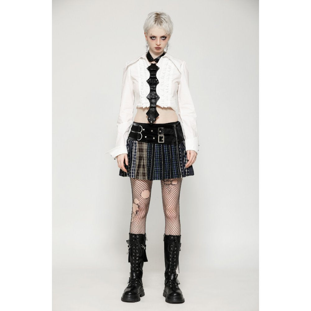 The Dark In Love Sage Mini Skirt elegantly styled on a model, showcasing its unique faux buckle detail and rebellious fashion aesthetic.
