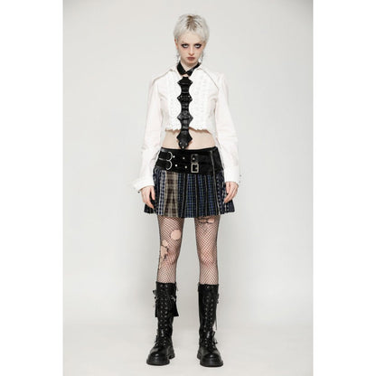 The Dark In Love Sage Mini Skirt elegantly styled on a model, showcasing its unique faux buckle detail and rebellious fashion aesthetic.