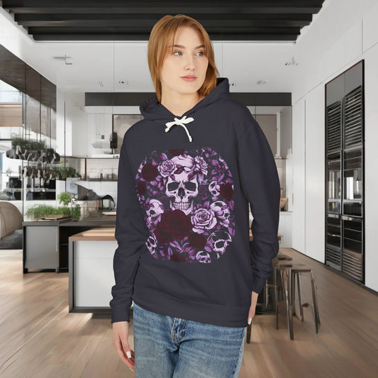 Unisex Lightweight Hooded Sweatshirt with a striking skull and roses design, worn by a model in a contemporary kitchen, highlighting its edgy appeal and modern comfort.