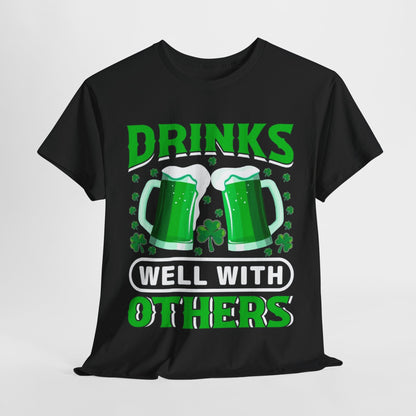 Funny St. Patrick's Day Unisex T-Shirt featuring a vibrant Irish Beer Mug Design with the phrase 'Drinks Well With Others' in bold green text, perfect for celebrating St. Paddy's Day with style and laughter.