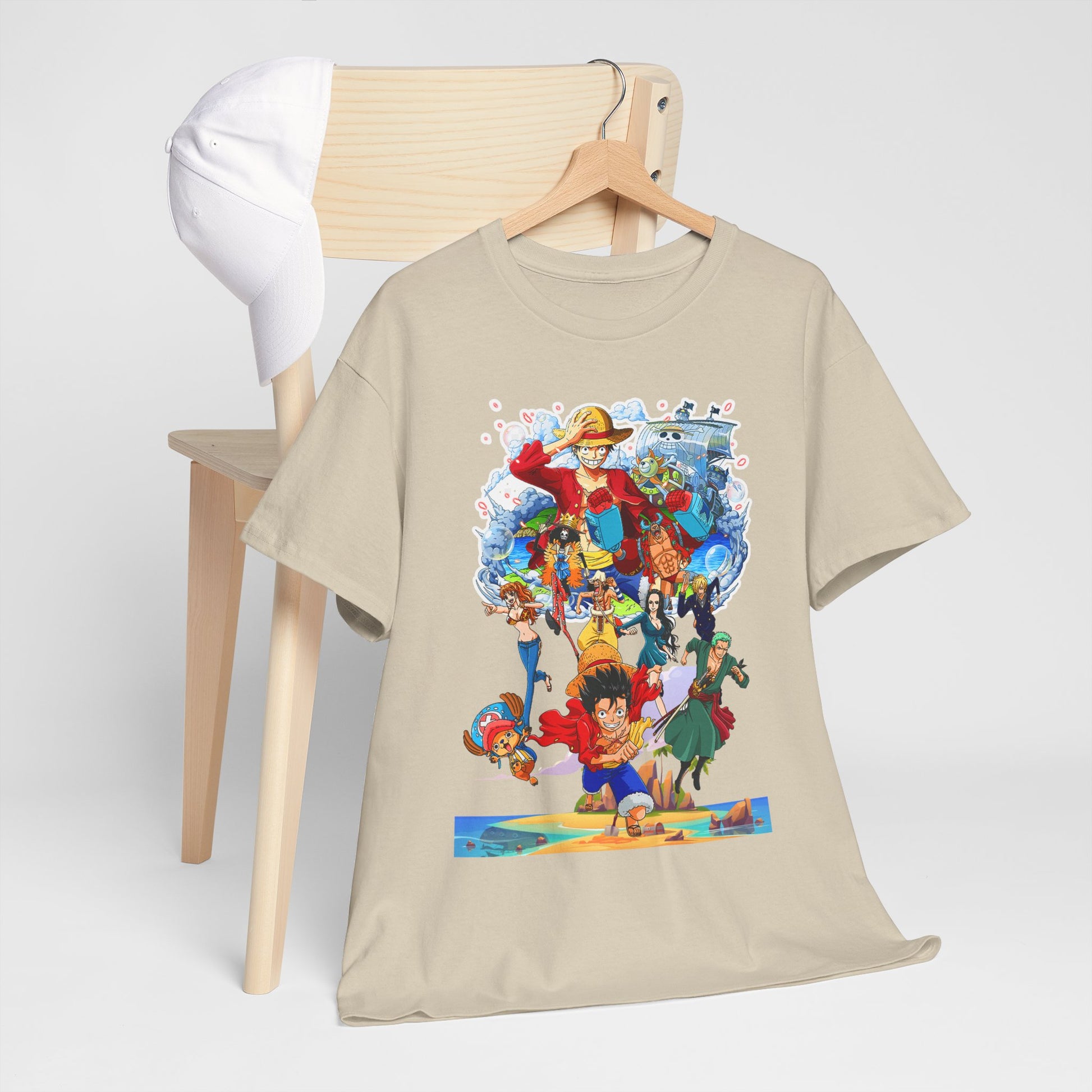 Stylish beige men's t-shirt displayed on a minimalist wooden chair alongside a trendy white cap, featuring captivating anime artwork of beloved characters.