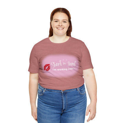 Sabrina Carpenter Inspired Unisex Short Sleeve Tee with Vibrant Lipstick Print, displayed on a plus-size model, highlighting the chic and versatile fit of this statement piece.