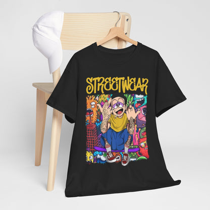 Trendy black streetwear t-shirt stylishly hung on a wooden chair, paired with a white cap, featuring vibrant urban art and bold 'STREETWEAR' text.