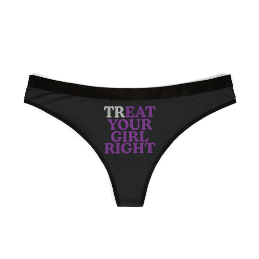 Elegant black thong showcasing the phrase 'TREAT YOUR GIRL RIGHT' in chic purple lettering, perfect for luxurious intimate wear.