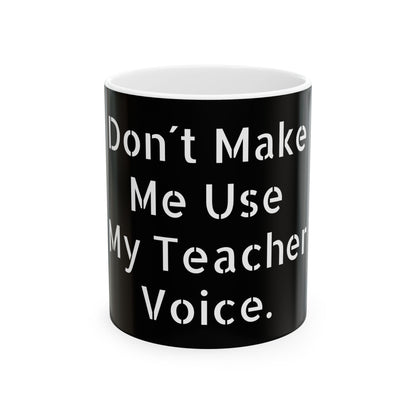 Elegant ceramic mug featuring the phrase 'Don't Make Me Use My Teacher Voice.' Perfect gift for those with a sense of humour, ideal for coffee lovers and office settings.