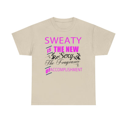 Stylish beige motivational t-shirt adorned with the powerful phrase 'SWEATY IS THE NEW SEXY' in bold pink and sophisticated black lettering, ideal for those embracing a fitness journey.