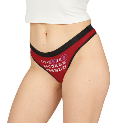 Luxurious and playful women's thong featuring bold '69' numbers in vibrant pinkish-purple hues, designed for stylish comfort and seductive flair. Ideal for adding a cheeky touch to your lingerie collection.