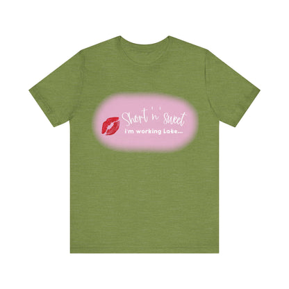 Sabrina Carpenter Inspired Unisex Short Sleeve Tee in elegant olive green with a striking lipstick design and text 'Short n sweet, i'm working Late...' perfect for fashionable casual wear.
