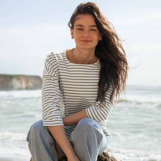 Elegant close-up of eco-friendly striped boat neck top made from midweight organic cotton, highlighting the chic 3/4 sleeves and flattering boxy fit.