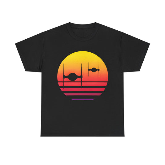 Elegant unisex t-shirt showcasing black silhouettes of TIE Fighters against a stunning sunset backdrop with vibrant orange and pink hues, titled 'Tie Fighters Sunset Star Wars Graphic Unisex Tee Shirt'.