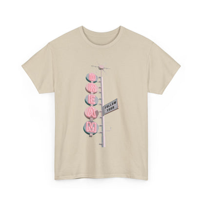Elegant unisex 'Follow Your Dream' graphic tee showcasing a nostalgic design with whimsical lettering in pink atop a soft beige fabric. Perfect for making a statement with a sophisticated flair.