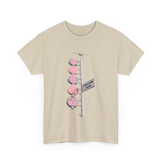 Elegant unisex 'Follow Your Dream' graphic tee showcasing a nostalgic design with whimsical lettering in pink atop a soft beige fabric. Perfect for making a statement with a sophisticated flair.