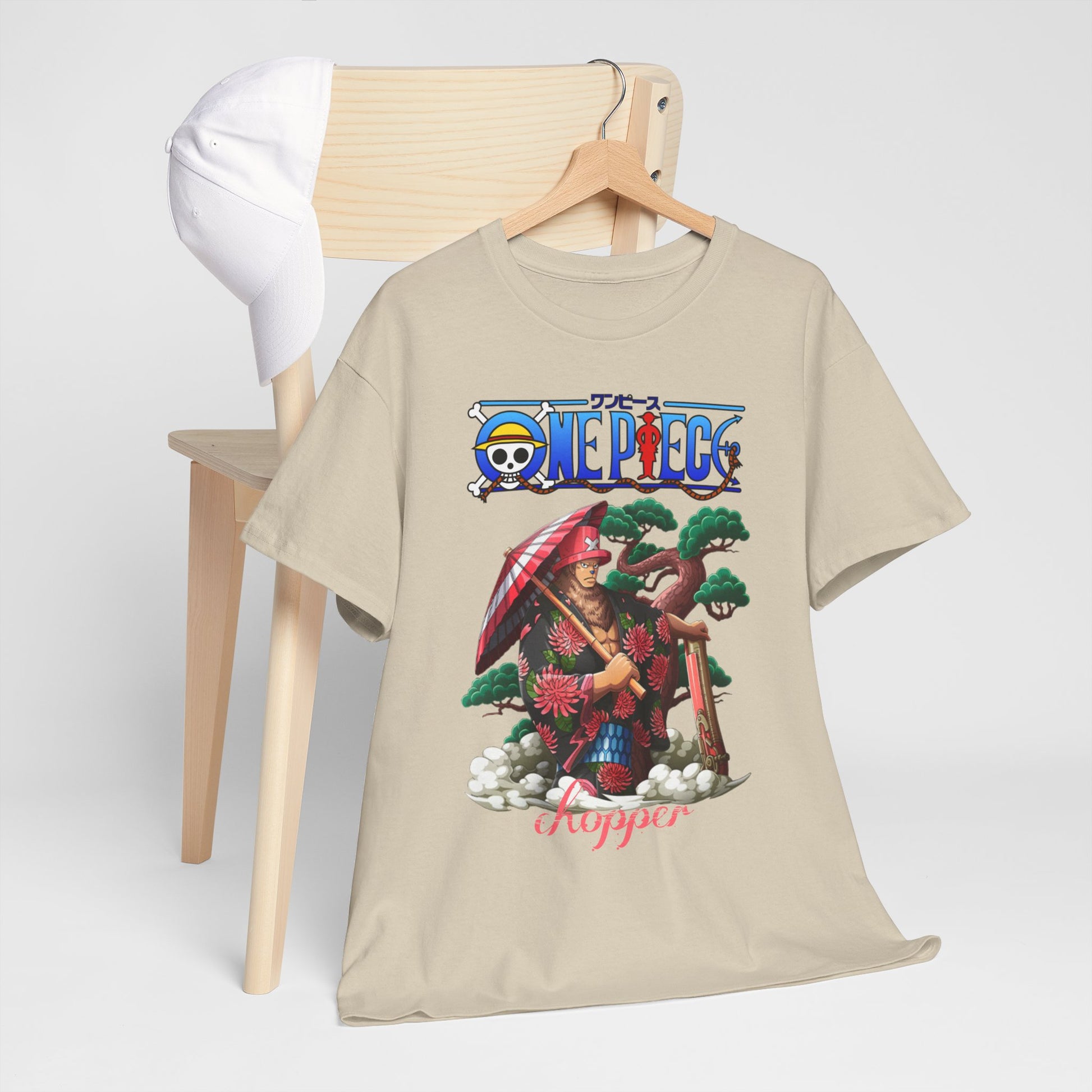 Charming t-shirt draped over a chair, displaying a striking Chopper design from One Piece, showcasing its vibrant and artistic essence in a casual yet refined manner.
