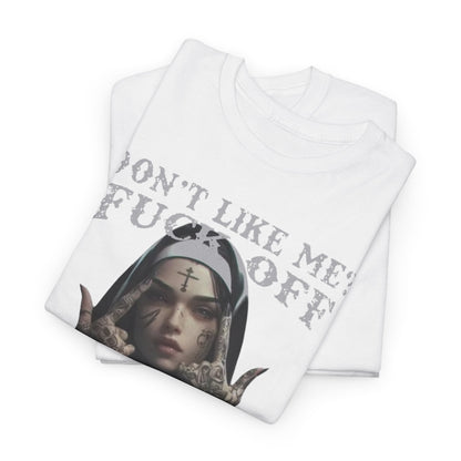 Stylish folded white t-shirts showcasing a unique tattooed nun design with the phrase 'Don't Like Me? FUCK OFF' printed prominently, ideal for fashionable individual expression.