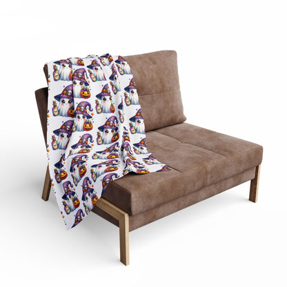 Elegant Decorative and Warm Halloween Cute Arctic Fleece Blanket draped over a stylish couch, showcasing fun ghost and pumpkin patterns for a festive touch.