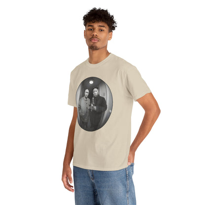 Male model showcasing a luxury 'Meet The Neighbours Funny Gift' graphic t-shirt, featuring a humorous design of two leaders in a fisheye perspective, perfect for urban streetwear.