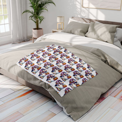 Chic Decorative and Warm Halloween Cute Arctic Fleece Blanket laid on a bed, featuring playful ghost motifs and pumpkins, ideal for enhancing your Halloween ambiance.