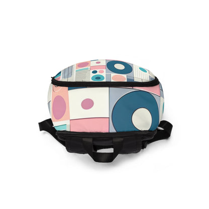 Chic pastel geometric backpack from Dazzling Dreams Studio featuring a blend of soft pink, blue, lavender, and mint hues, showcasing a stylish design perfect for modern fashion enthusiasts.
