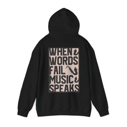 Chic black hoodie showcasing the powerful phrase 'WHEN WORDS FAIL MUSIC SPEAKS' adorned with saxophone designs, ideal for stylish music lovers.