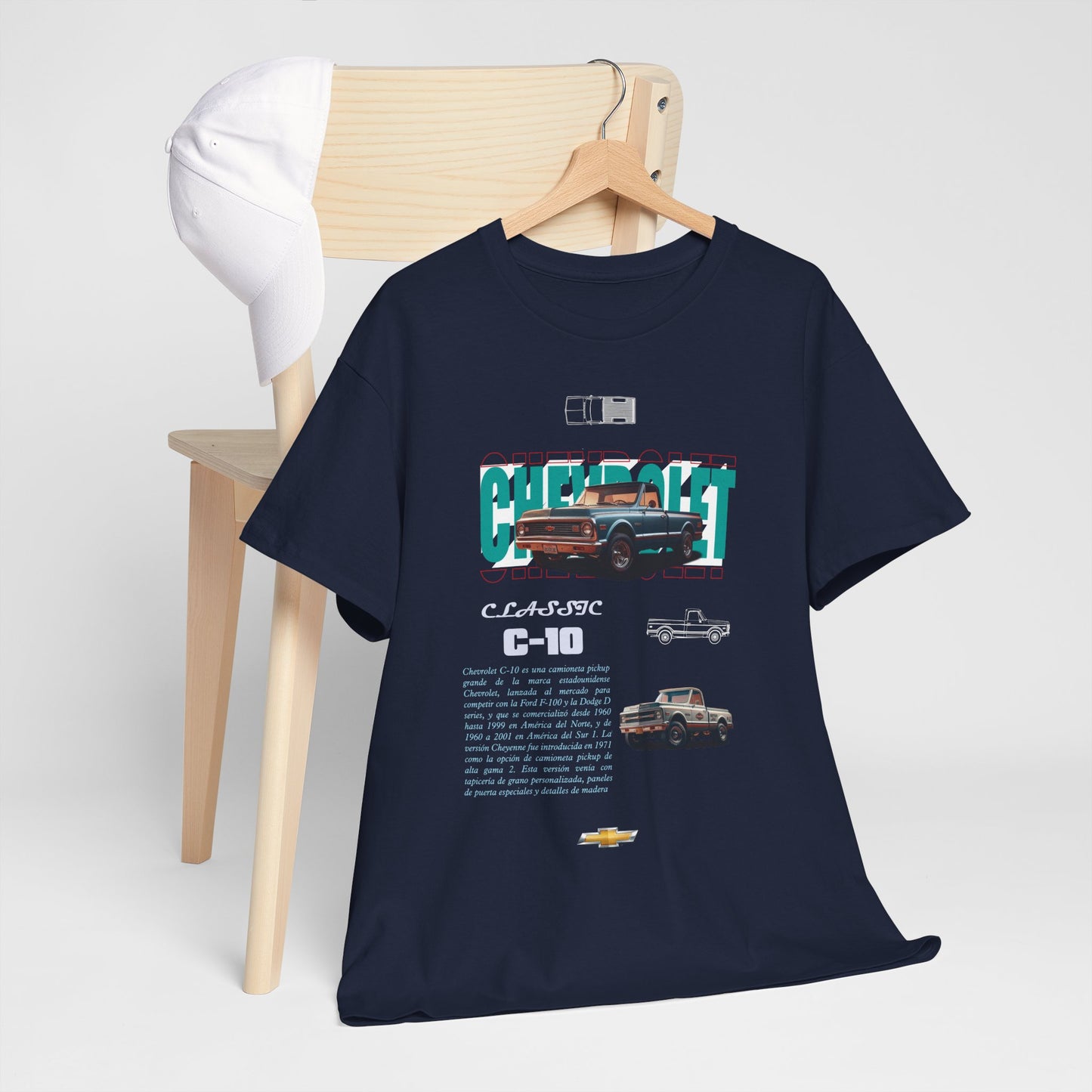 Stylish Chevrolet C-10 men's t-shirt paired with a classic white cap, displayed on a modern wooden chair for a sophisticated look.