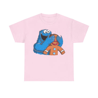 Cookie Monster guess who Graphic Unisex Tee Shirt in pastel pink, showcasing a delightful illustration of Cookie Monster playfully covering a gingerbread man’s eyes, a luxurious choice for casual elegance.