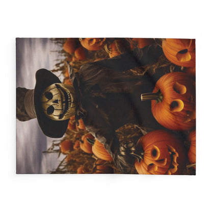 Refined Decorative and Warm Halloween Spooky Arctic Fleece Blanket depicting a scarecrow with an eerie expression surrounded by spooky pumpkins, perfect for stylish autumnal décor.