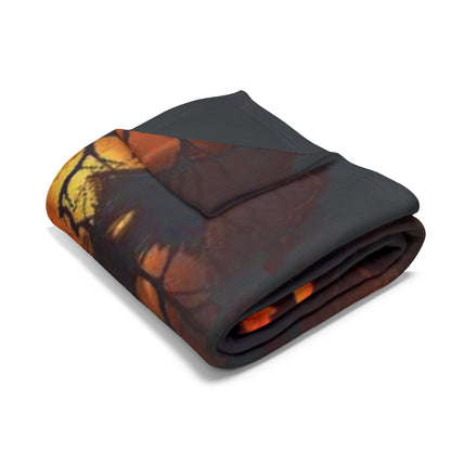 Luxurious Decorative and Warm Halloween Spooky Arctic Fleece Blanket, featuring a vibrant orange and black design, elegantly folded to showcase its softness and warmth. Ideal for adding a touch of seasonal charm to your home.