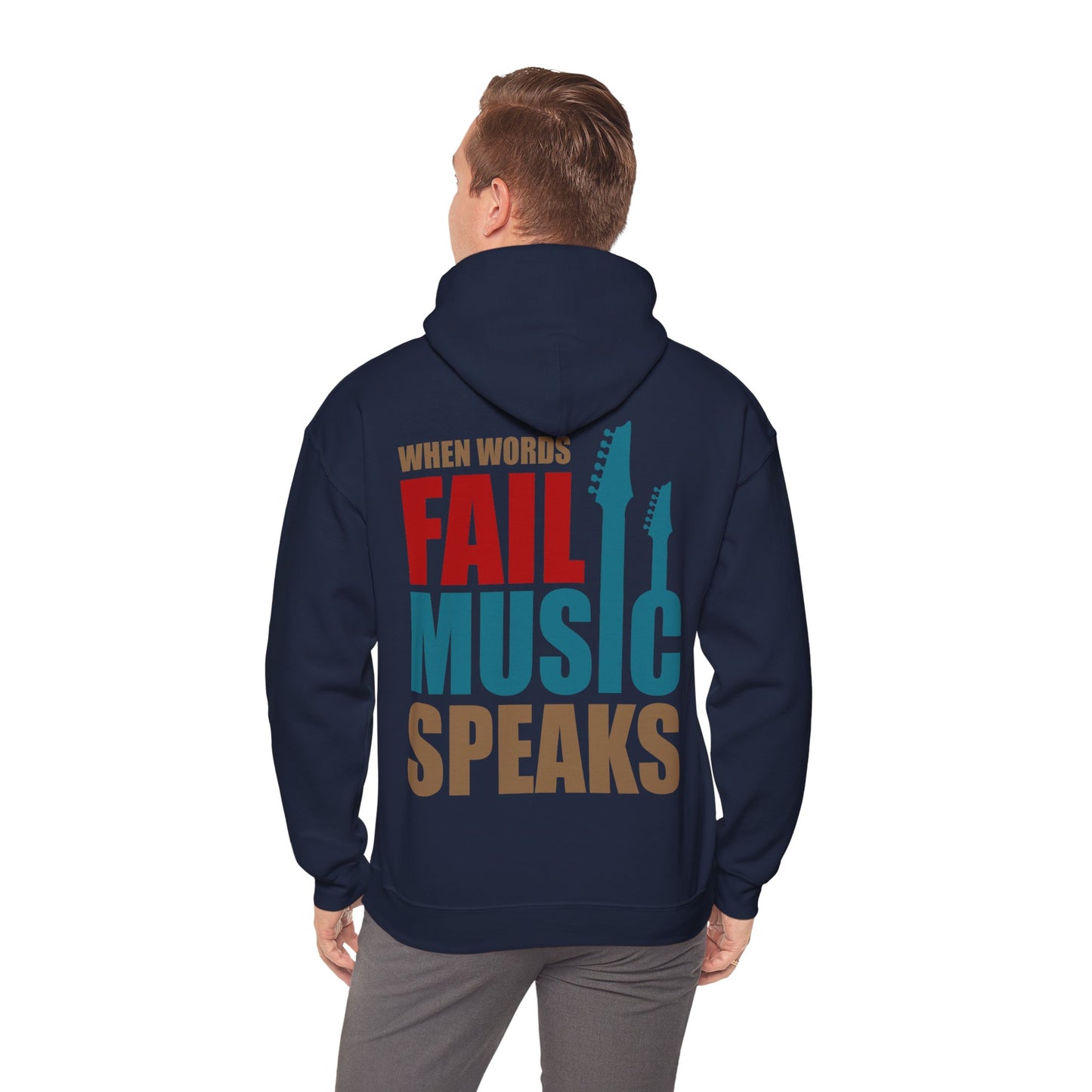 Man wearing a chic navy hoodie with the striking phrase 'WHEN WORDS FAIL MUSIC SPEAKS' on the back, complemented by guitar silhouettes, perfect for music lovers seeking style and comfort.