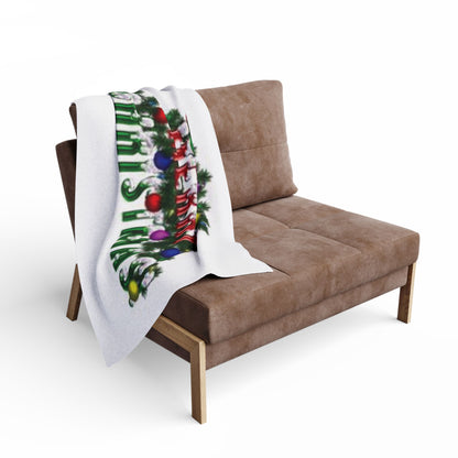 Beautifully draped Decorative and Warm Christmas Arctic Fleece Blanket on a stylish sofa, enhancing the festive atmosphere of any living space.