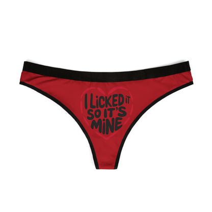 Front view of a luxurious red women's thong with a stylish heart graphic stating 'I Licked It So It’s Mine', perfect for romantic occasions.