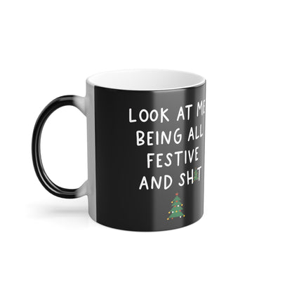 Elegant Look At Me Being All Festive Christmas Gift Colour Morphing Mug, featuring the playful phrase 'Look At Me Being All Festive and Shit' and artistic embellishments of festive trees.