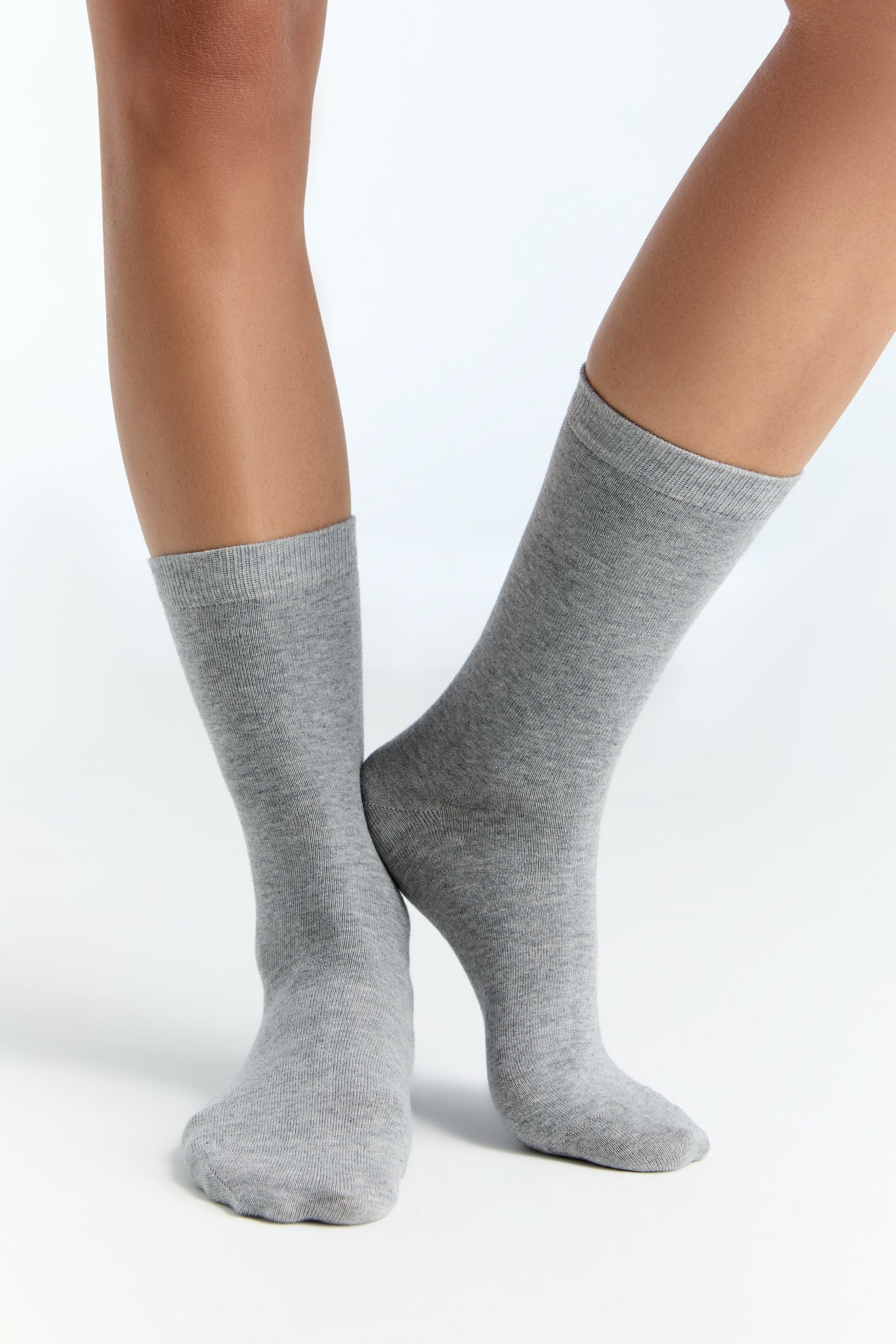 Close-up of luxury organic cotton socks highlighting fine elastane threads and superior softness.
