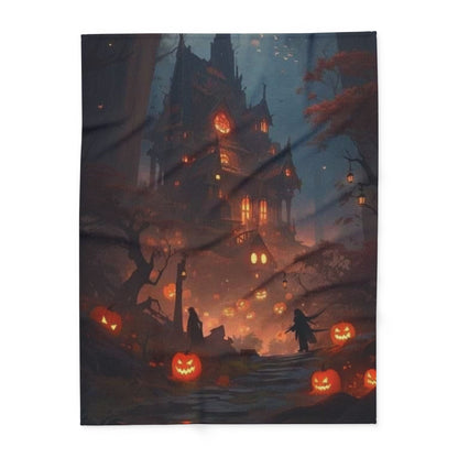 A plush decorative Halloween Arctic fleece blanket displaying a haunting landscape with pumpkins and a spectral house, designed for warmth and style during the spooky season.