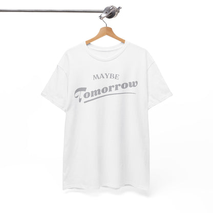 Sophisticated white t-shirt on a wooden hanger, showcasing the playful 'Maybe Tomorrow' graphic in refined grey lettering, perfect for a casual yet stylish look.