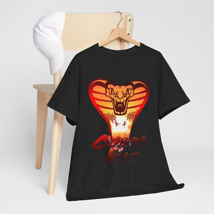 Chic lifestyle shot of a Cobra Kai t-shirt draped stylishly on a chair with a cap, highlighting the casual elegance of martial arts apparel.