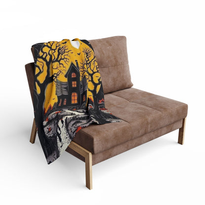 Decorative and Warm Halloween Spooky Arctic Fleece Blanket elegantly draped over a modern chair, illustrating its chilly night charm, perfect for upscale Halloween gatherings.