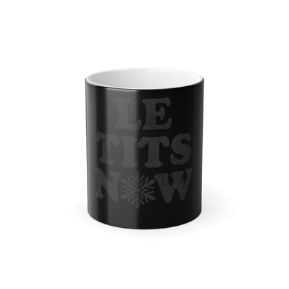 Let It Snow Le Tits Now Colour Morphing Mug showcasing a playful design in matte black, perfect for festive cheer and modern gifting. This transformative 11oz novelty Christmas mug reveals a cheeky message when filled with hot beverages, making it a luxurious addition to seasonal celebrations.
