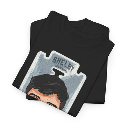 Peaky Blinders Thomas Shelby Unisex Men Women Graphic Funny T Shirt Tee Urban, showcasing a neatly folded black T-shirt with a striking graphic of Thomas Shelby.