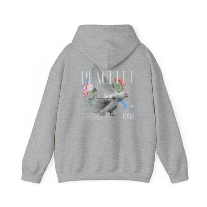 Refined grey hoodie displaying a beautifully illustrated dove alongside floral elements, featuring the bold lettering 'PEACEFUL 1980' for a sophisticated style statement.