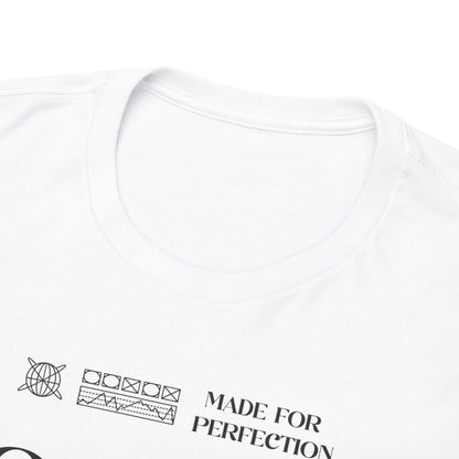 Close-up view of the collar of a white t-shirt, showcasing premium fabric and the text 'MADE FOR PERFECTION', exemplifying luxury in automotive fashion.