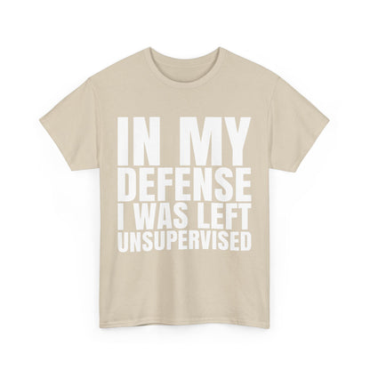 Elegant beige unisex graphic tee shirt featuring the phrase 'In My Defense, I Was Left Unsupervised', designed for geeks and crafted from 100% premium cotton.