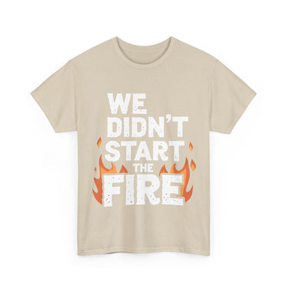 Elegant We Didn’t Start the Fire graphic t-shirt in soft beige, adorned with striking flames and bold lettering, combining artistry with comfort.