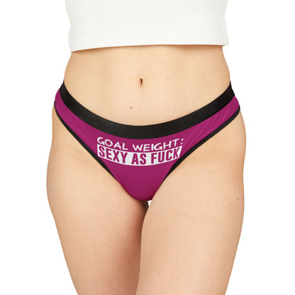 Luxury women's thong in vibrant pink with bold text reading 'Goal Weight: Sexy As Fuck', designed for playful and cheeky occasions, blending allure and humour.